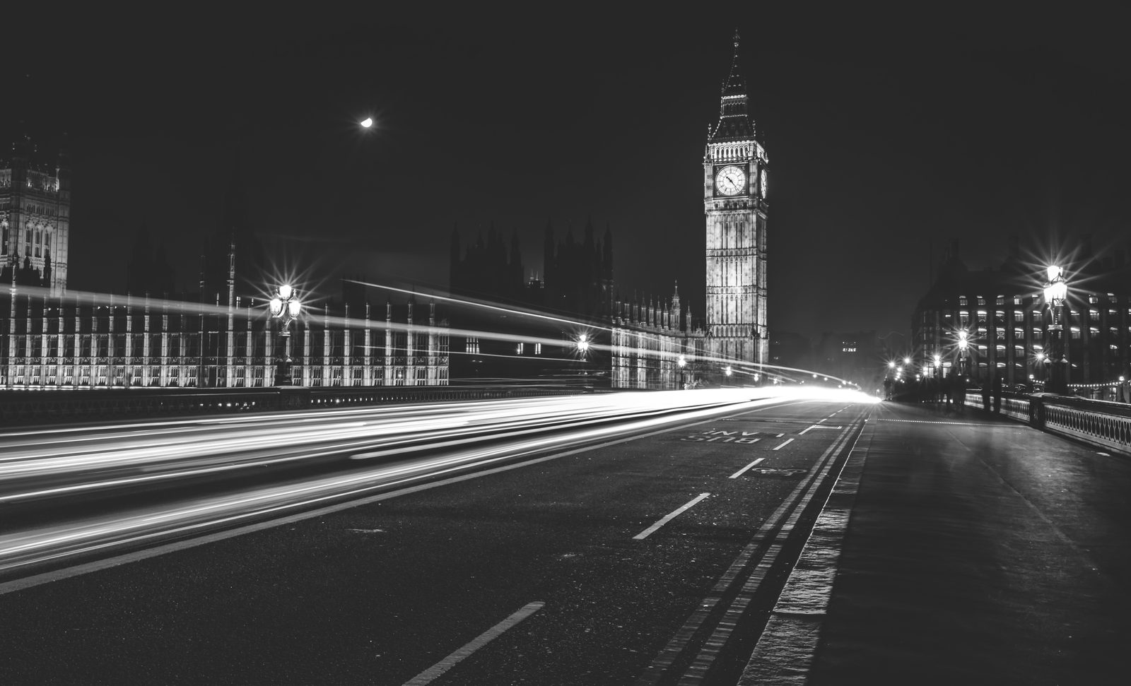 Night photograph of Elizabeth Tower and light trails on Westminster Bridge
